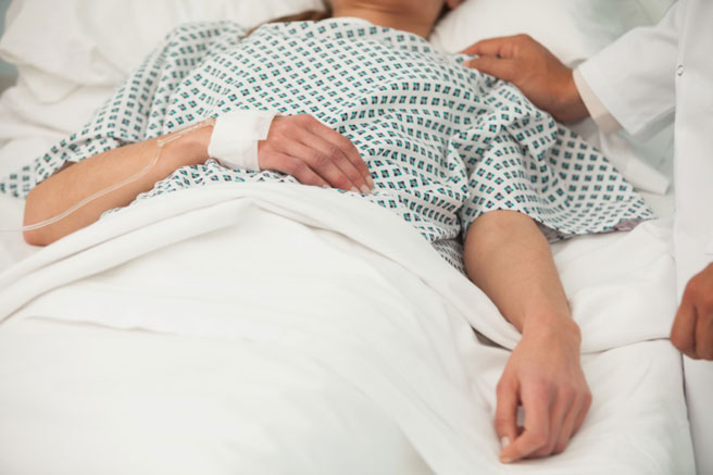 Lady Lying in Hospital Bed — Maplewood, MI — Corner Home Medical