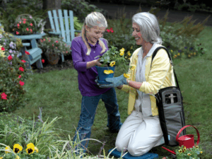 Mom With Daughter Taking Care Of Plants — Hutchinson, MN — Corner Home Medical