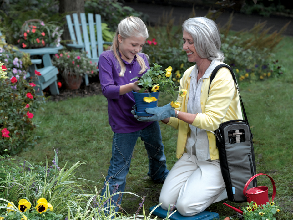 Mom With Daughter Taking Care Of Plants — Hutchinson, MN — Corner Home Medical